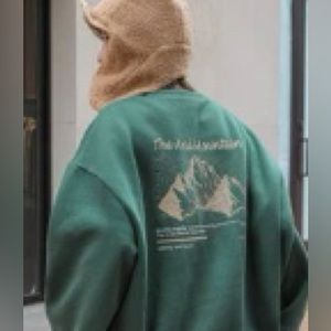 Green crewneck design on back and front
